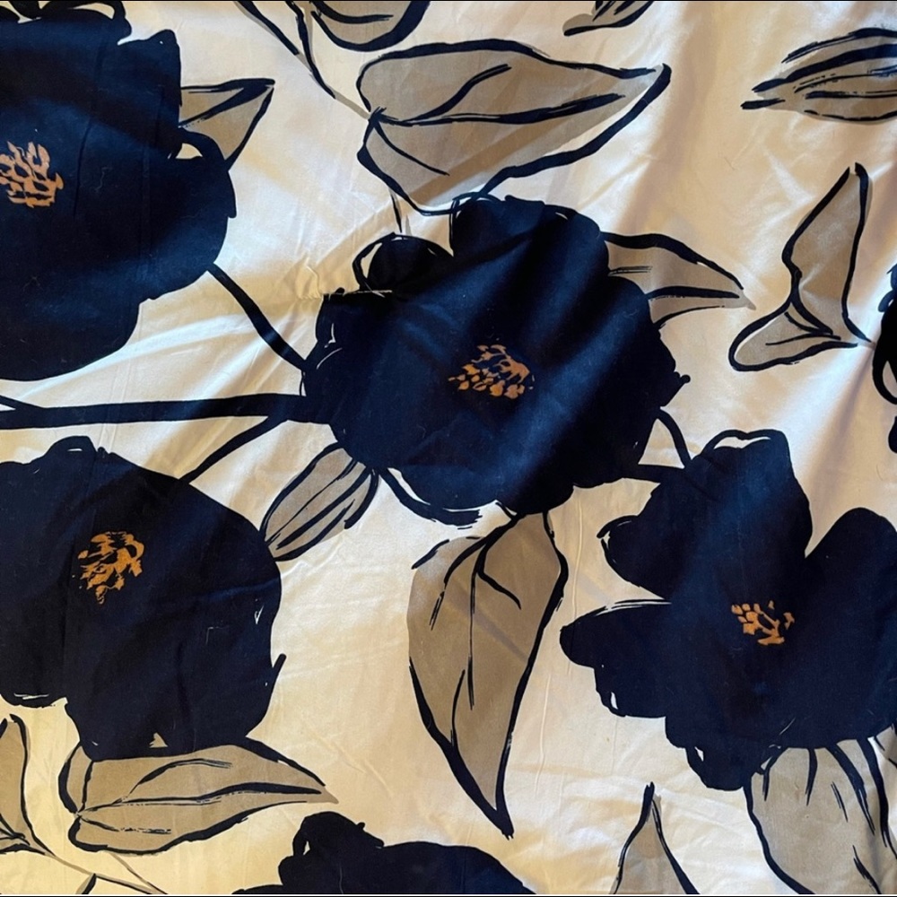 White comforter with blue flowers